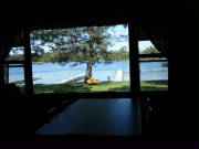 Cabin 3 lakeside picture window is located in the dining area.  What a view!