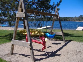 Lakeside Swings for all ages.  Infant swing, big-kid swing, and double-horse-swing!  This set is located adjacent to the Sand Castle Zone